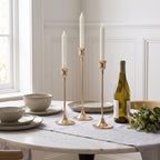 Metal Taper Candlestick Set of 3, tall set in light gold, lifestyle photo