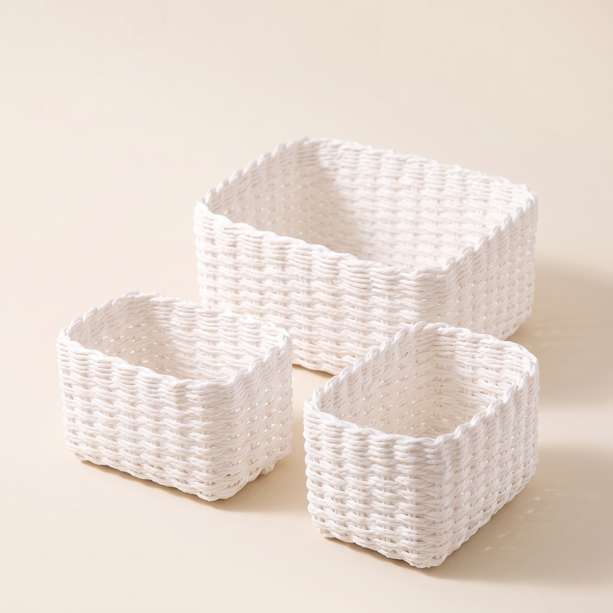 Set of three white rectangular paper rope baskets, product photo
