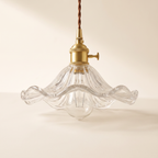 Clear ribbed glass flower pendant light with brass fitting, product photo
