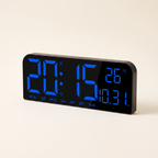 Small LED digital wall clock with blue display, product photo